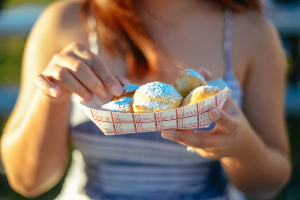 a woman holding a cake